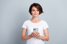 Porrtait Of Gorgeous Positive Lady Hold Use Apple Iphone Gadget Chatting Texing Isolated On Grey Color Background