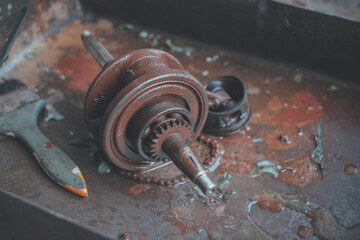 Wall Mural - Maintenance and repair of the motorcycle engine transmission system by a mechanic.	