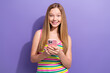 © deagreez - Photo of clever positive schoolgirl with straight hairdo dressed striped top hold smartphone read email isolated on violet background