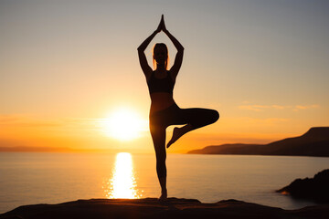 Canvas Print - Strength in Stillness: Athletic Female Practicing Yoga in Nature's Embrace