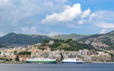 Wall Mural - Ferry boats at the harbor of Messina with city in the background