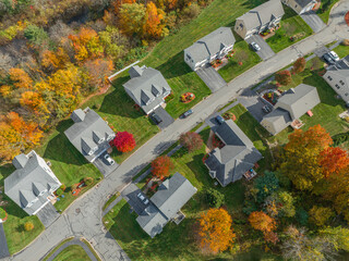 Wall Mural - aerial drone view of neighborhood street with single family homes in autumn