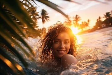 Wall Mural - Young cheerful woman bathing in warm tropical sea