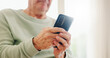 © Wesley JvR/peopleimages.com - Home, closeup and senior hands with a cellphone, typing and connection with social media, digital app and contact. Old man, pensioner or mature guy with a smartphone, mobile user and search internet