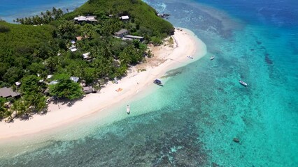 Wall Mural - mantaray island, yasawas, fiji. aerial shot over remote tropical island with small village and resor