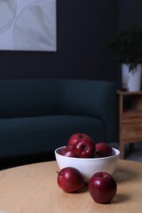 Poster - Red apples on wooden coffee table in room