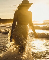 Canvas Print - Woman walking on the coast on vacation