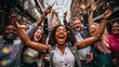 © Phoophinyo - A happy diverse team of startup business people celebrate their business success amidst confetti.