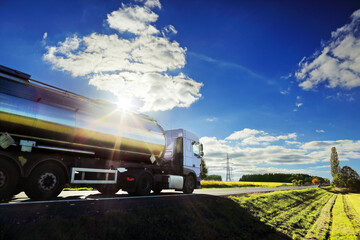 Wall Mural - Truck on the road at sunset