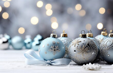 Christmas Background With Copy Space, Light Blue And Silver Christmas Balls On Wooden Floor, New Year Glitter Baubles On Magic Bokeh Background. Winter Holidays Festive Decoration, Greeting Card.