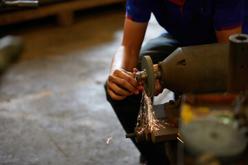 closeup worker hands drilling cnc machine in the factory