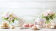 Mothers Day tea table scene over a white wood background
