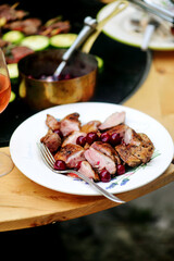 Wall Mural - Duck Breast with Cherry Sauce on the outdoor grill.style rustic