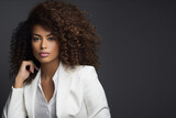 Fototapeta  - Black women with curly hair in white suit professional 