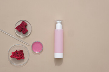 Sticker - The unlabeled pink bottle with spray tip is decorated with fresh dragon fruit and glass props. Antioxidants in dragon fruit prevent skin from acne, reduce acne inflammation and help brighten skin.