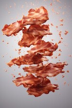 Crispy Fried Bacon With Crunchy Fly In The Air On Pastel Background