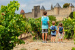 © Sergey Novikov - Young explorers ready for Carcassonne castle medieval adventure