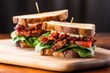 blt sandwich with excessive bacon on toasted sourdough