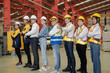 © Nassorn - Diverse group of warehouse workers standing at storehouse with team, portrait. Multicultural men and women working together at cargo factory. Latino, Hispanic, Caucasian, Asian people teamwork concept
