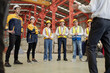 © Nassorn - Diverse group of warehouse workers standing at storehouse with team, portrait. Multicultural men and women working together at cargo factory. Latino, Hispanic, Caucasian, Asian people teamwork concept