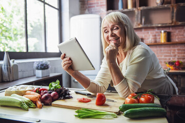 Wall Mural - Old woman in the kitchen