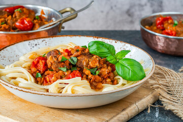 Sticker - Meatballs in a tomato and lentil sauce with linguine pasta