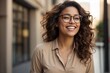 © alexx_60 - Laughing Beautiful Young Woman with Glasses and Curly Hair on City Background