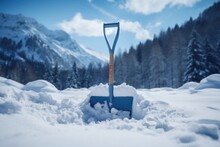 Shovel For Snow Removal In The Mountain Of Snow