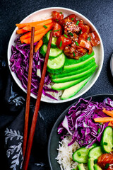 Canvas Print - Salmon poke bowl with vegetables and avocado.top veiw