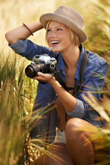 Wall Mural - Field, excited or woman with a camera, photographer or sunshine with tourism, travelling or nature. Person, photography or girl with summer, happiness or countryside with picture, outdoor or creative