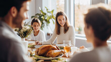 A Family Is Together For Dinner With Turkey Chicken Roast And Food On Table On Thanksgiving Day, Enjoy Eating And Chatting