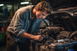 © colnihko - Attractive confident male auto mechanic working in Car Service