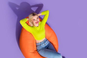 Sticker - High angle view photo of lovely positive girl stylish green lime color clothes sitting empty space isolated on purple background