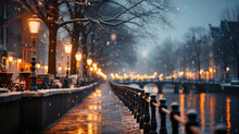 Amsterdam Canal At Night With Lights And Snowfall, Netherlands.