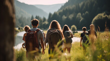 A Group Of Unrecognizable Teenagers Walking Together In Nature At A Summer Camp