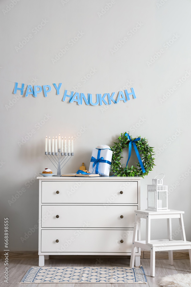 Interior of living room decorated for Hannukah with commode and stepladder