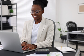 Poster - Professional accountant working on computer at desk in office