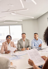 Wall Mural - happy diverse executive board work group talking at office meeting. busy diverse professional worker