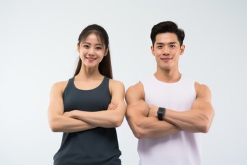 Wall Mural - The Asian gym couple posing while looking at the camera generative ai