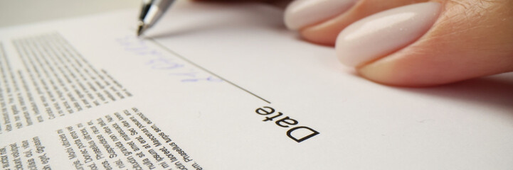 Wall Mural - Woman writes date above line after signing contract papers