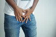 the concept of prostate and bladder problem, crotch pain of a young person 