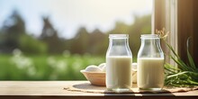 Fresh Milk Delight. Rustic Bottle For Healthy Mornings. Naturally Nutritious. Close Up Of Dairy Products In Wood Setting. Rural Wellness. Jug And Products On Wooden Table