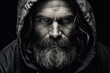 Dramatic monochrome portrait of bearded man with intense eyes
