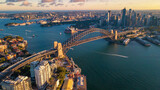 Aerial drone view of Sydney City and Sydney Harbour showing Sydney Harbour Bridge in the late afternoon     