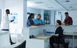 © Wavebreak Media - Diverse female doctors discussing work, using tablet at reception desk at hospital