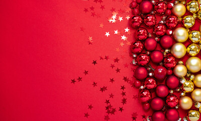 Poster - Beautiful red Christmas background with many golden red balls and stars.