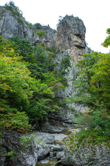 Wall Mural - The beautiful deep valley, early autumn mountain landscape.