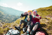 Elderly Lesbian Couple Waving To A Smartphone Video Call While Out Hiking In Nature