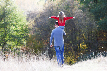 Wall Mural - father walks with child emotions concept family