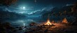 Night camping at the lake. campfire under a night sky full of stars against a backdrop of blue water and forest. Outdoor concept